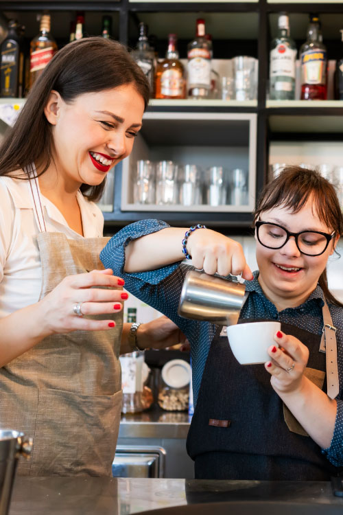 person living with disability as a barista through NDIS customised employment